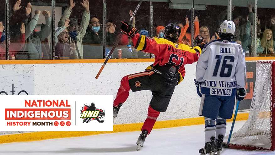 An indigenous hockey player celebrates after scoring a goal.
